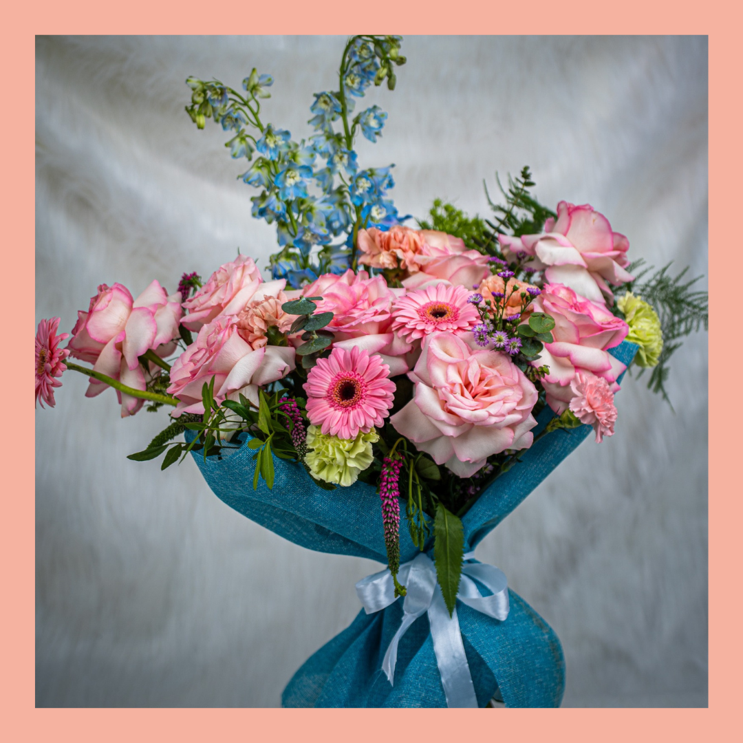 Elegant red rose anniversary bouquet by Le Ronza Flowers